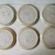 Set of 6 flat plates made of pyrity sandstone, signed