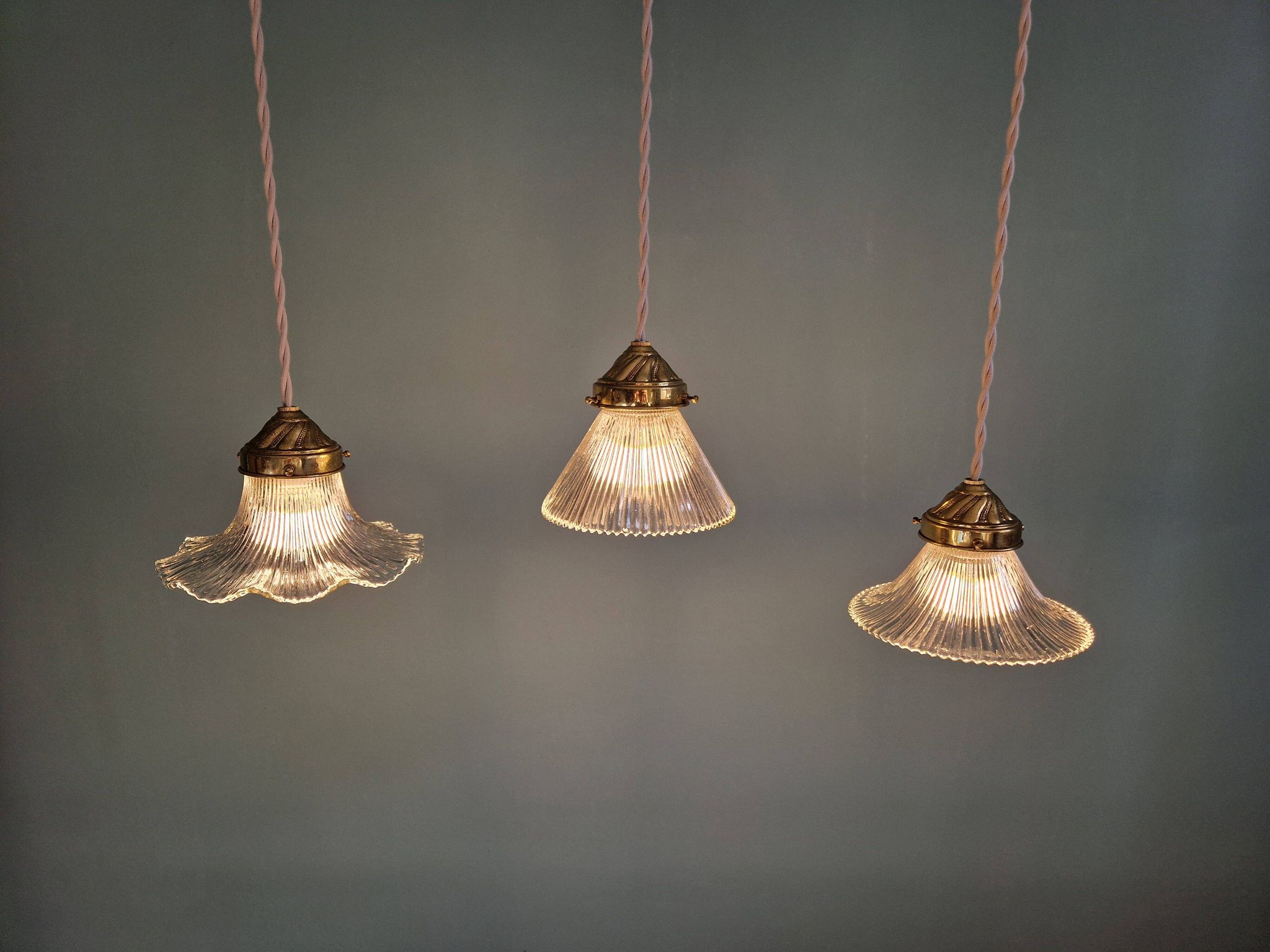 Trio of Art Deco grooved glass pendant lights, 1920s-30s