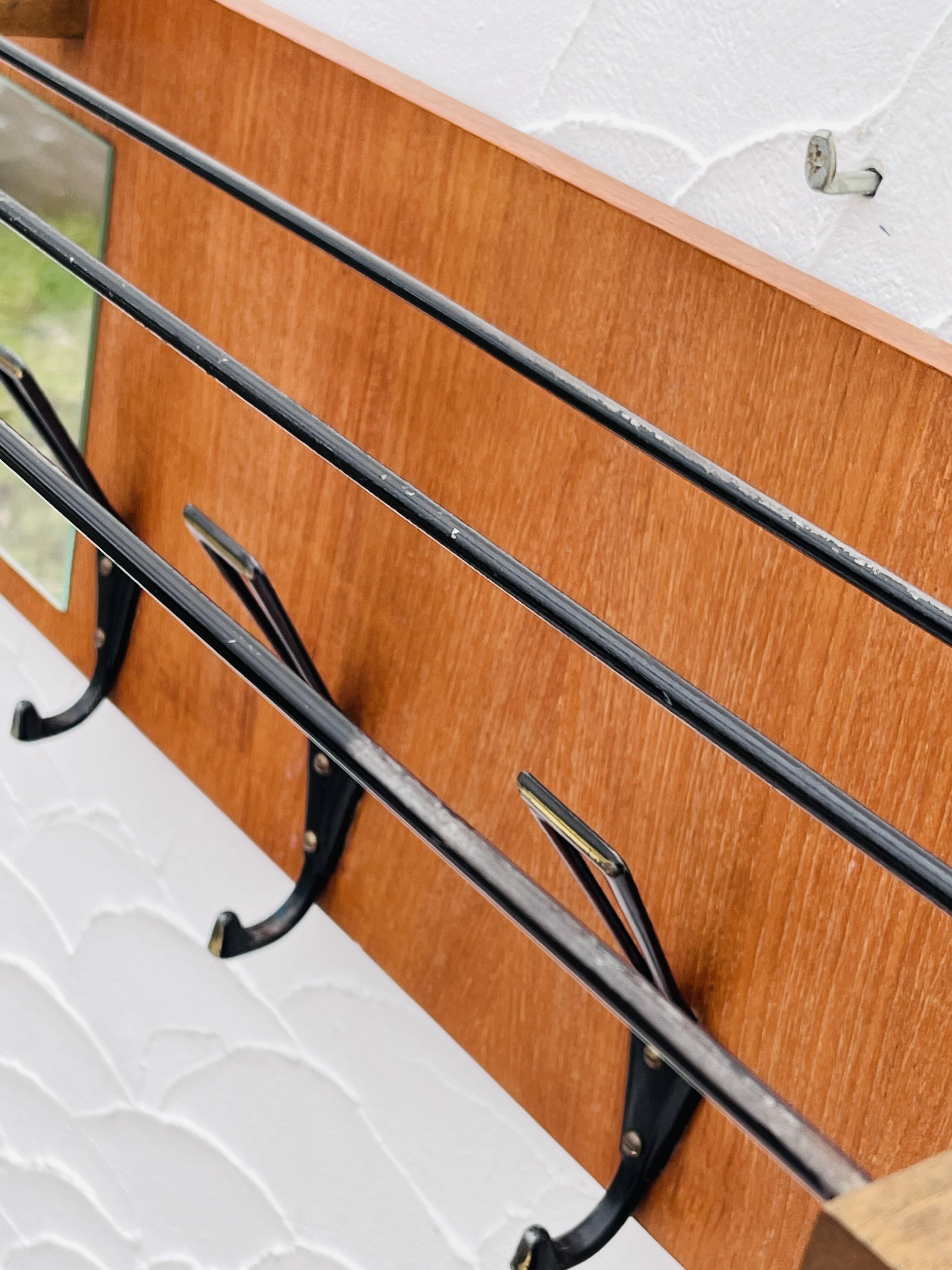 Vintage wooden wall coat rack mirror from the 1960s.