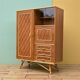 Rattan wardrobe with tapered legs from the 1960s.