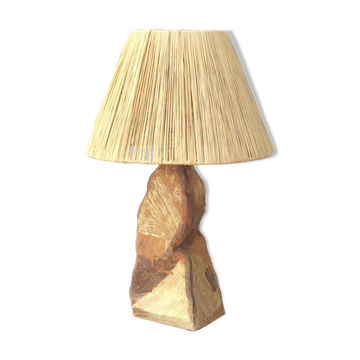 Brutalist lamp in stoneware with a raffia shade.