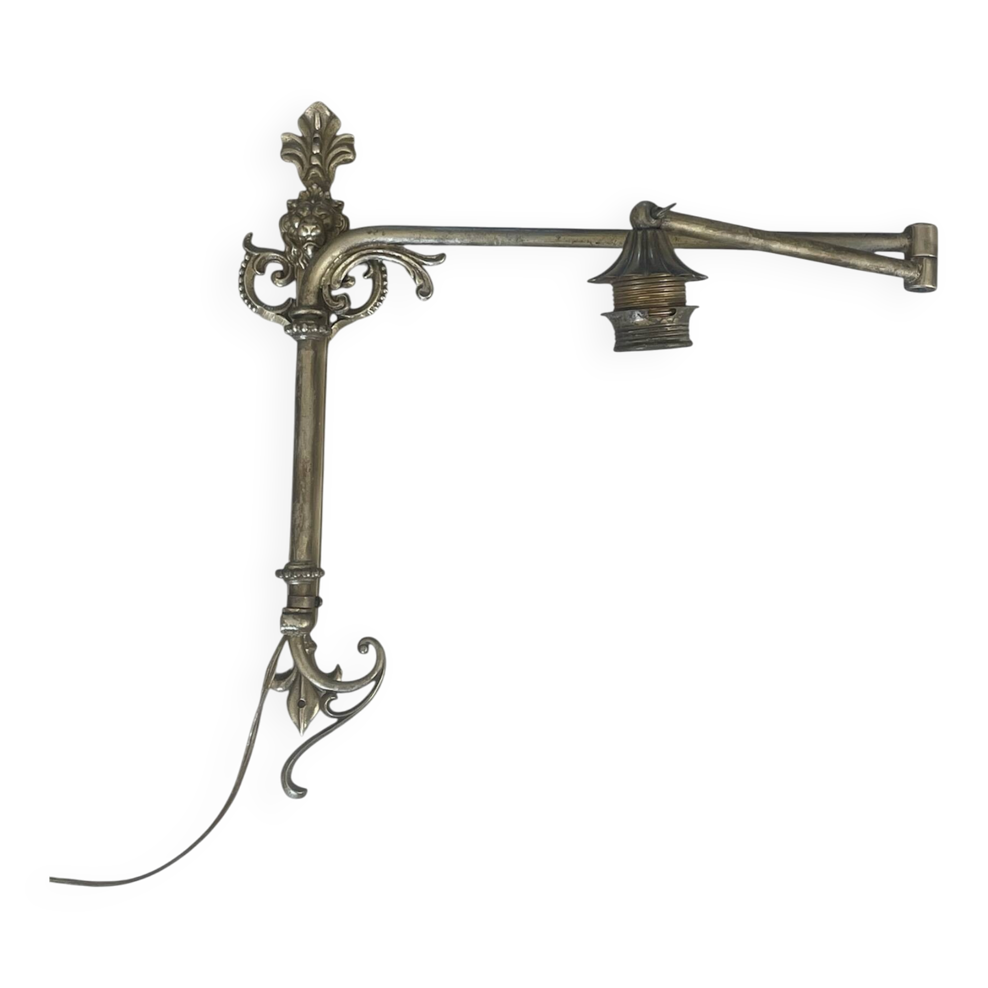 Adjustable wall light in brass and gold metal.