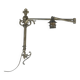 Adjustable wall light in brass and gold metal.