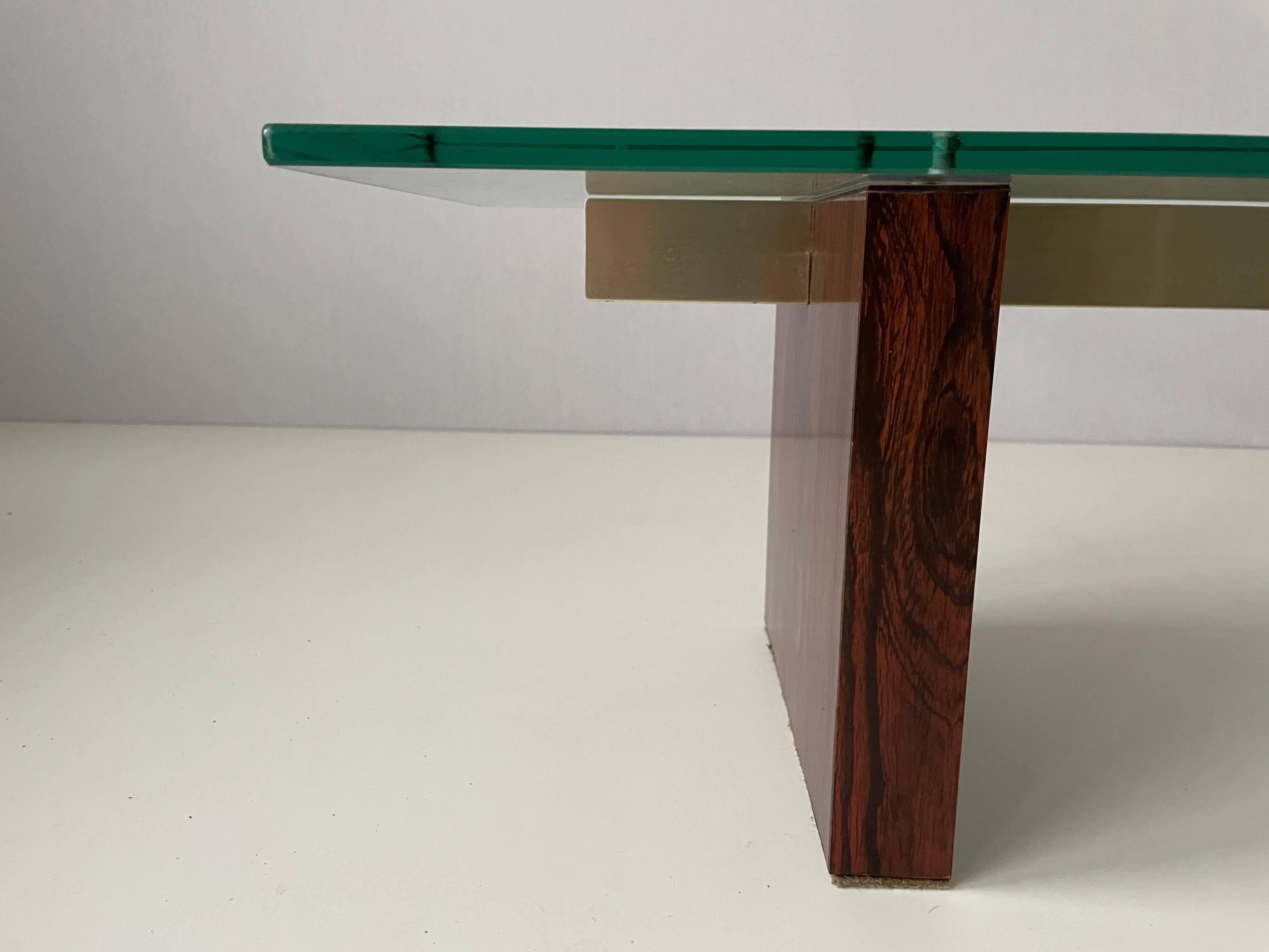 Mid-century minimalist thick glass coffee table, rosewood legs, 1960, Germany.