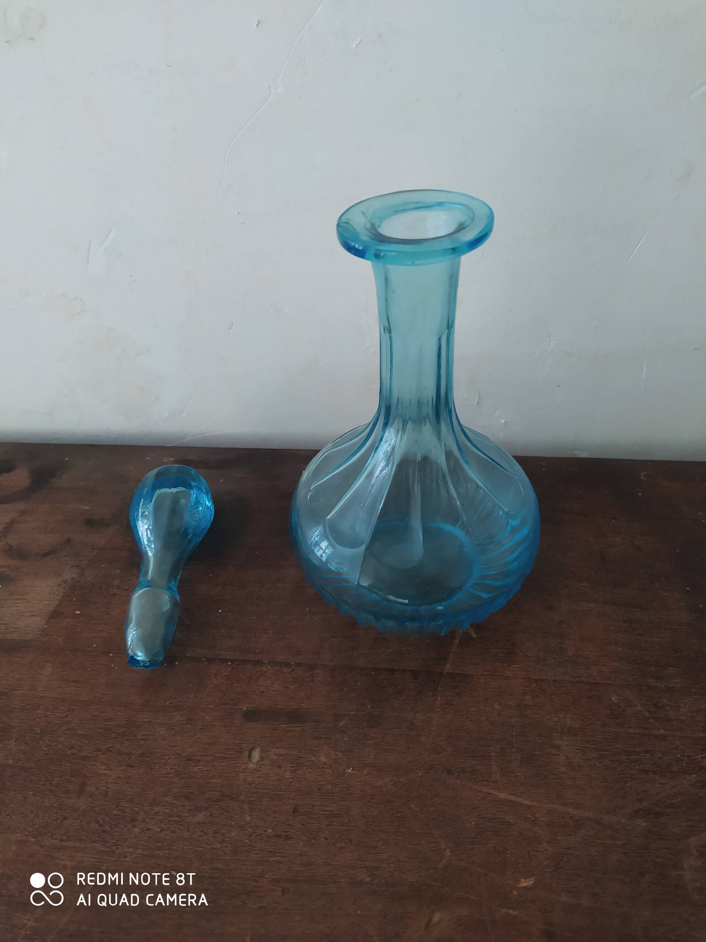 Set including a bottle and a turquoise blue glass jar