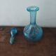 Set including a bottle and a turquoise blue glass jar