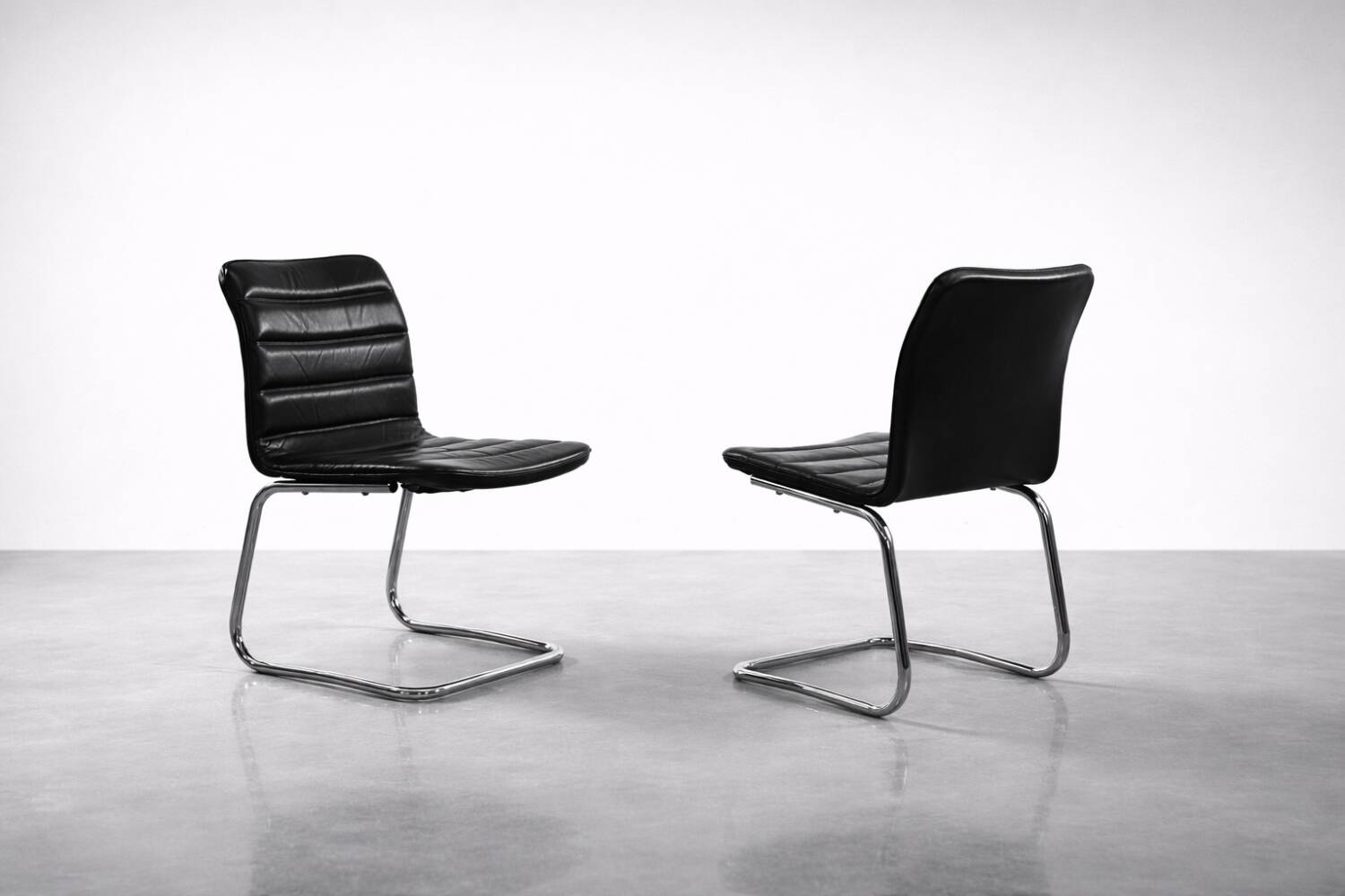 Vintage Mid-Century Minimalist Chrome and Black Leather Club Chairs
