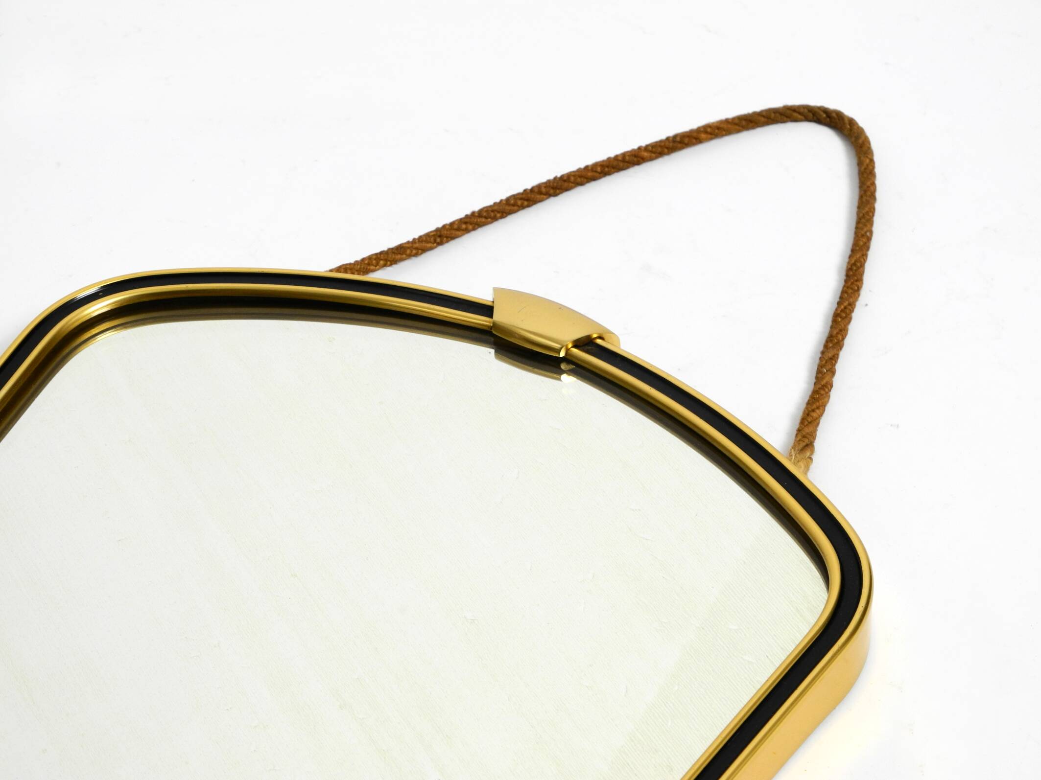 Beautiful small mid-century brass wall mirror with braided hanging strap