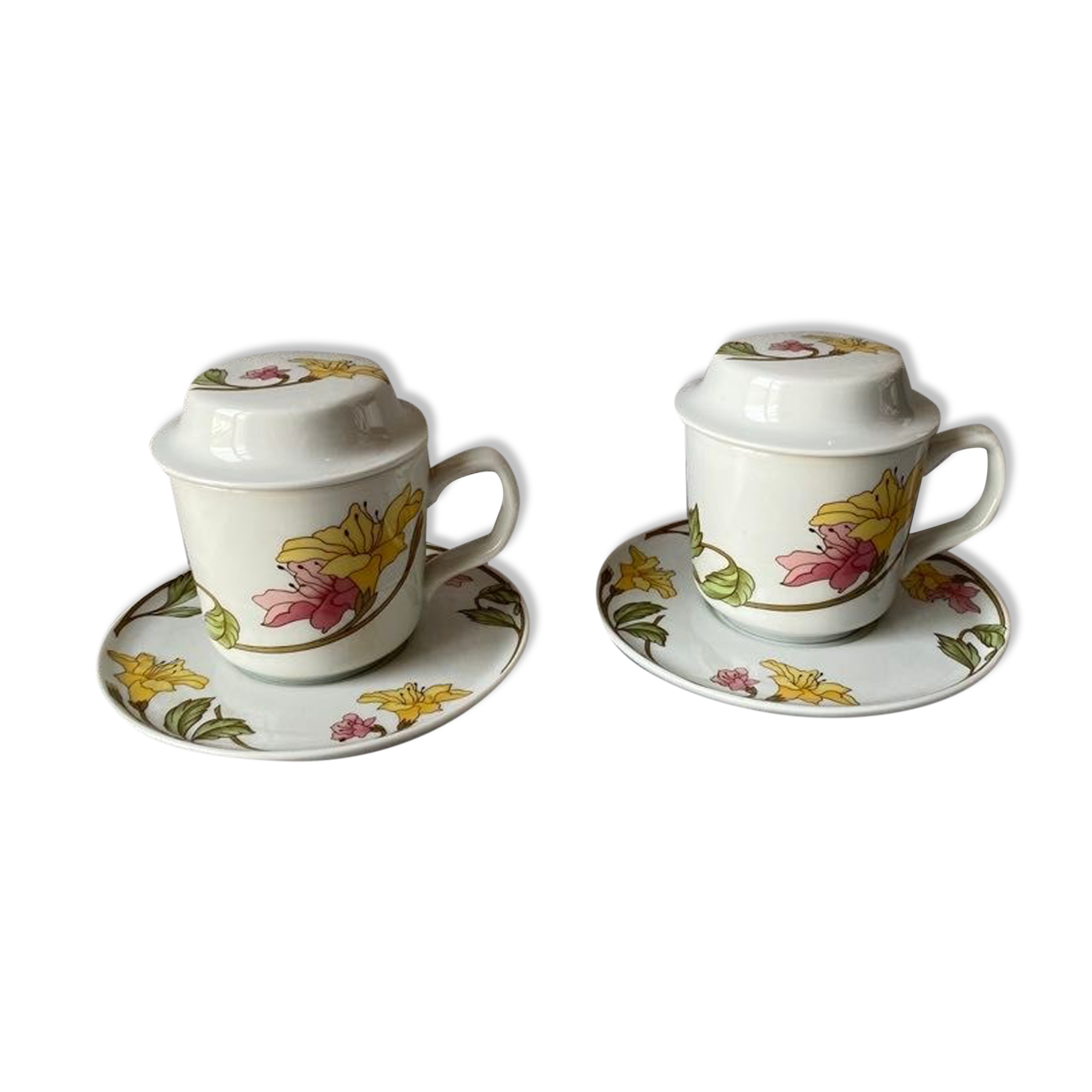 Two cups with herbal tea from the Faiencerie of Pillivuyt