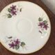Two porcelain cups with violets