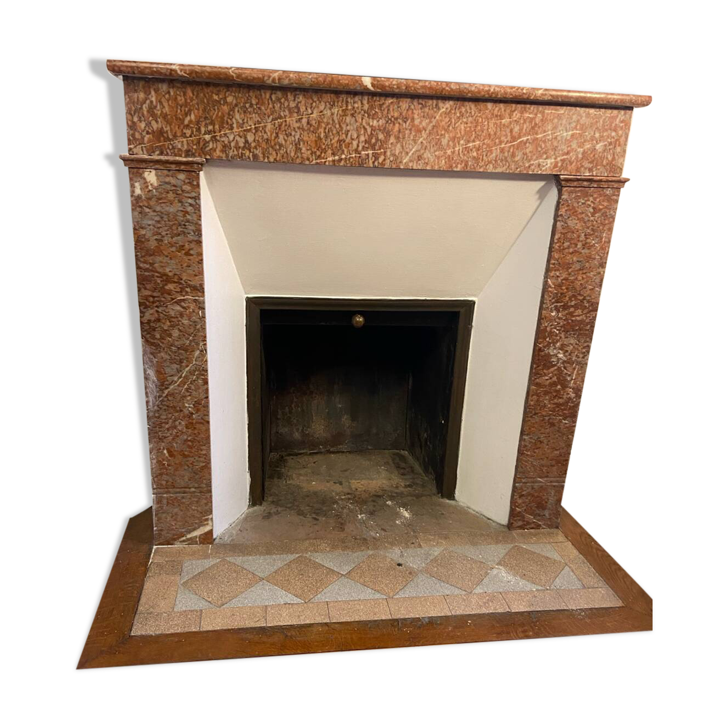Marble fireplace surround with closed hearth frame.
