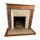 Marble fireplace surround with closed hearth frame.