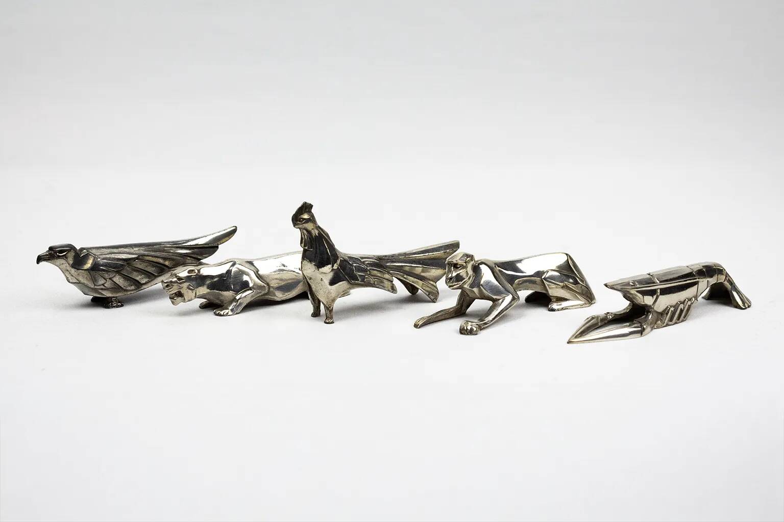 10 porte-couteaux animaliers Art déco en métal argenté – dlg Sandoz, Gallia