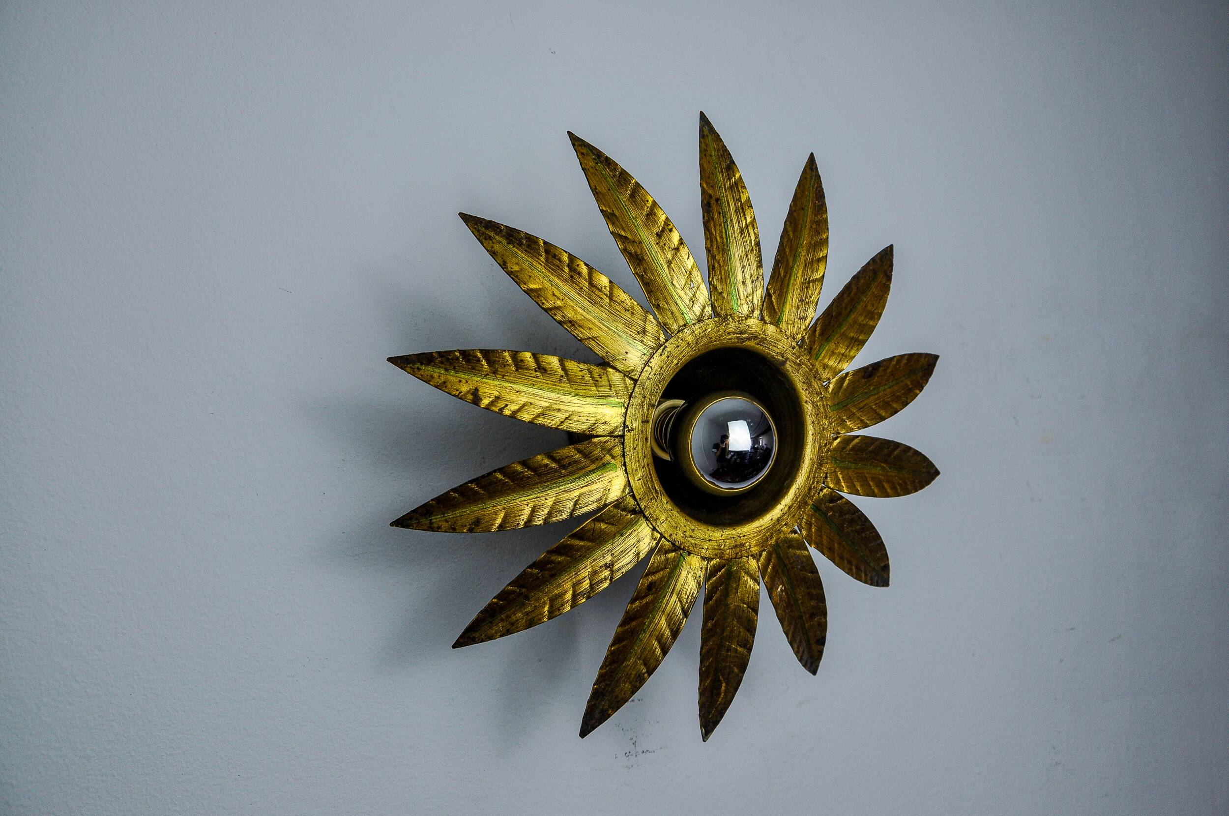 Sun wall lamp by ferro arte, metal and gold leaf, Spain, 1960