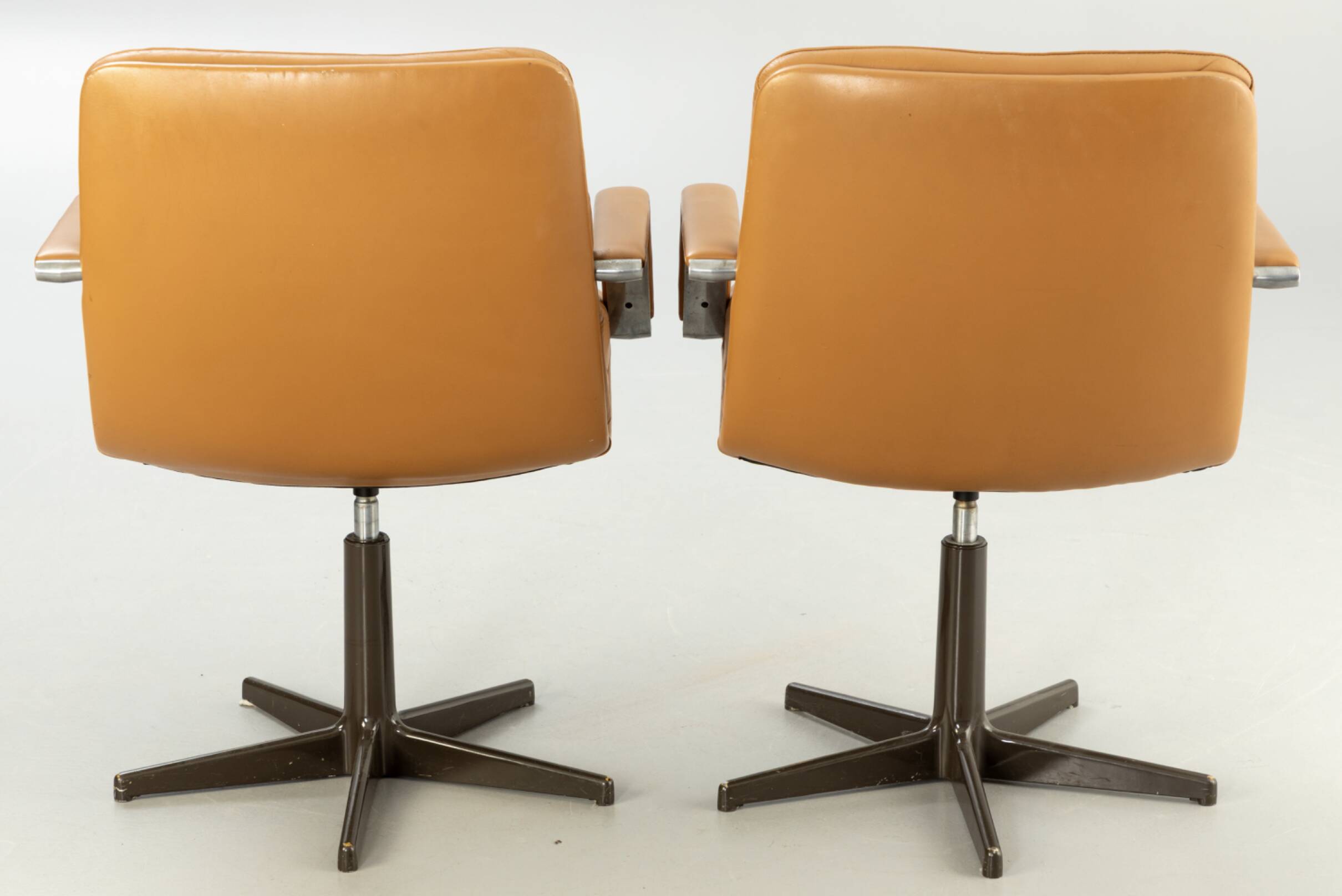 Pair of swivel armchairs by Geoffrey Harcourt.