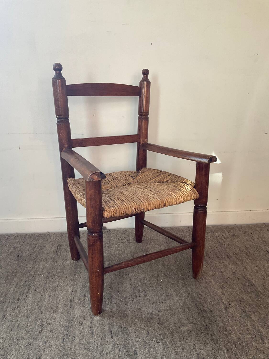 Vintage wooden armchair and straw seat for children
