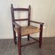 Vintage wooden armchair and straw seat for children