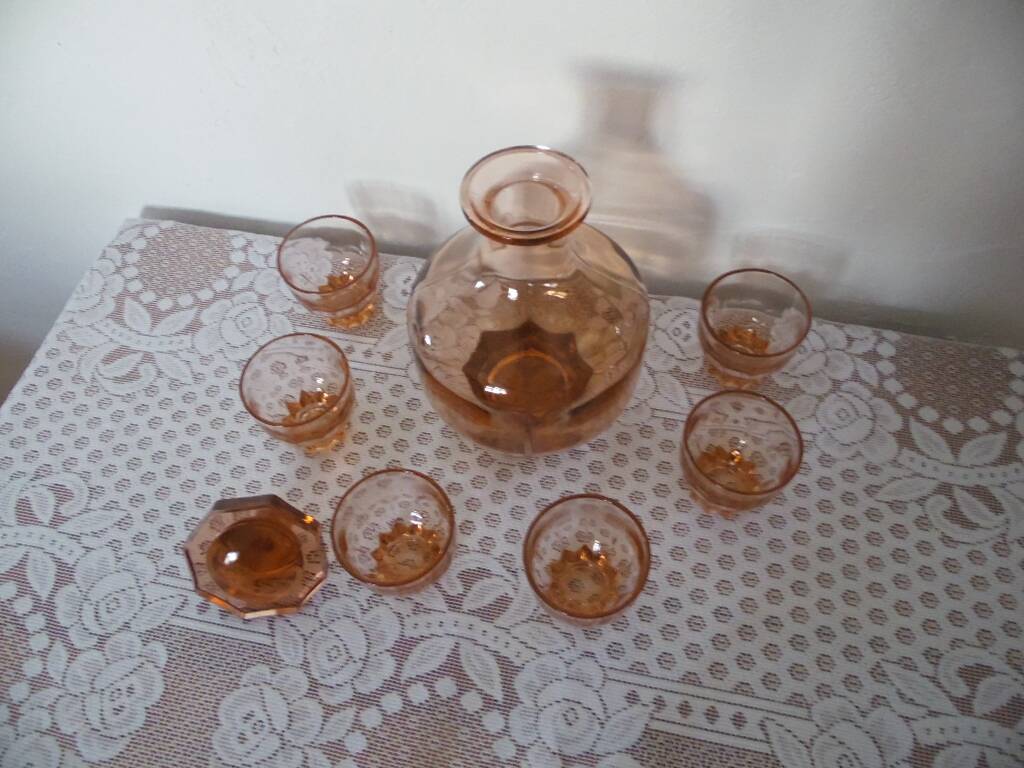 Pink glass liqueur carafe and 6 matching glasses