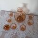 Pink glass liqueur carafe and 6 matching glasses