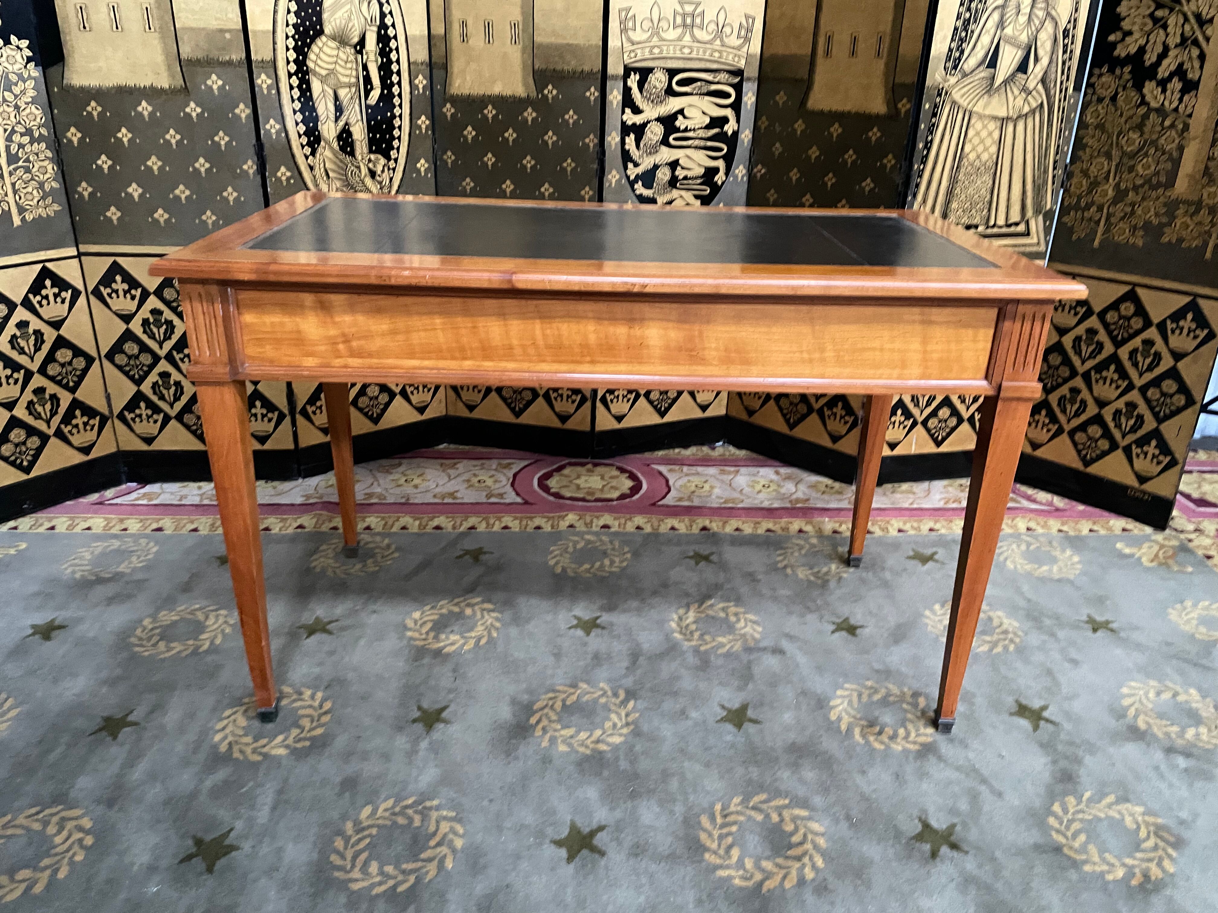 Desk full of Louis XVI style black leather