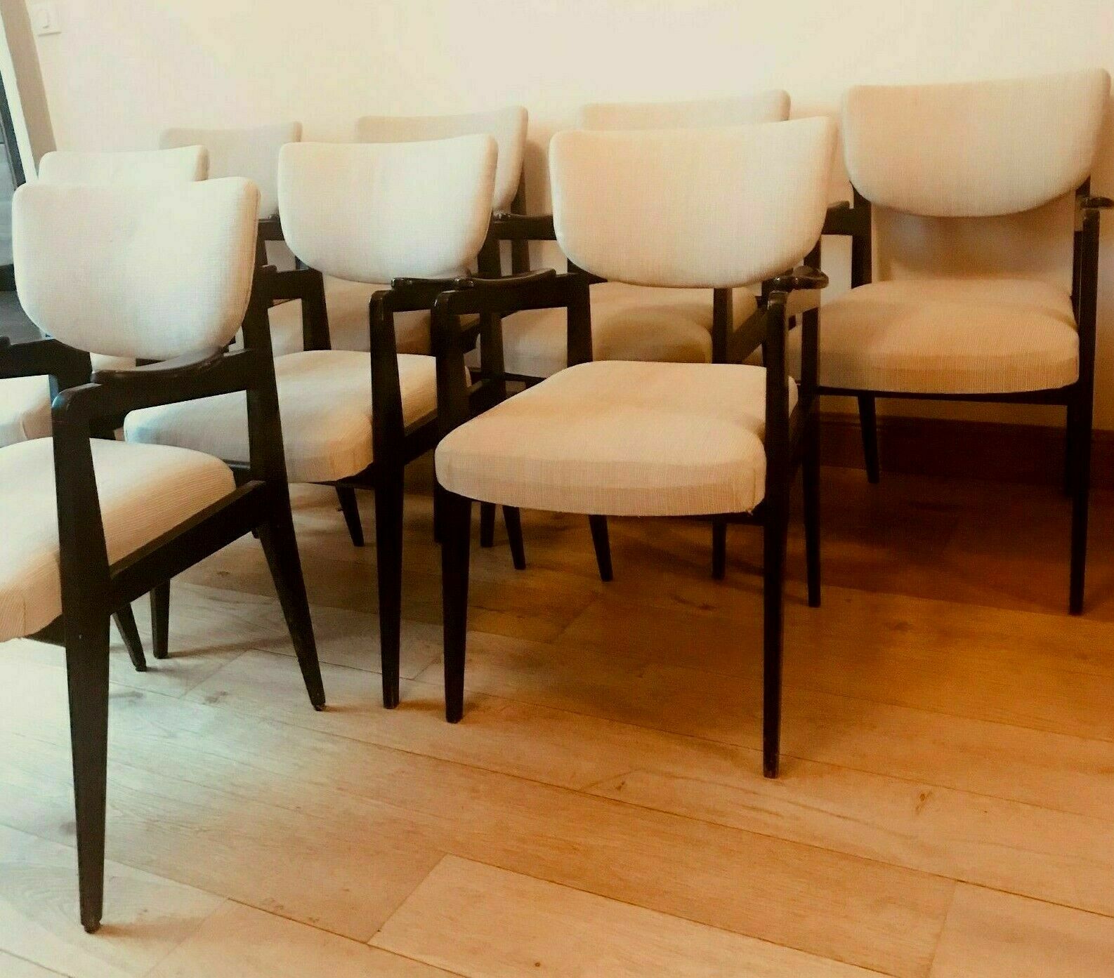 Suite of eight design chairs from the 60s in 10th century blackened wood