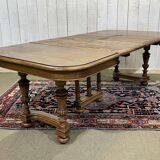Henri II walnut table from the early 20th century with extensions.