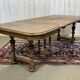 Henri II walnut table from the early 20th century with extensions.