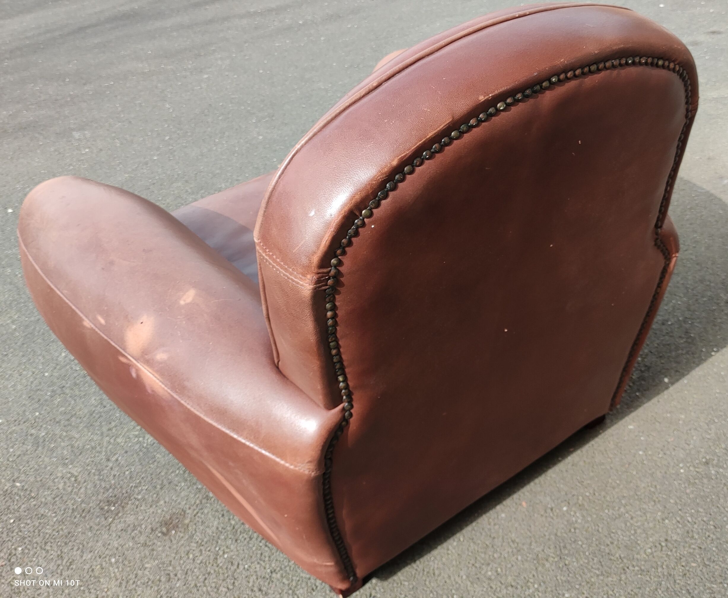 Club chair in brown leather