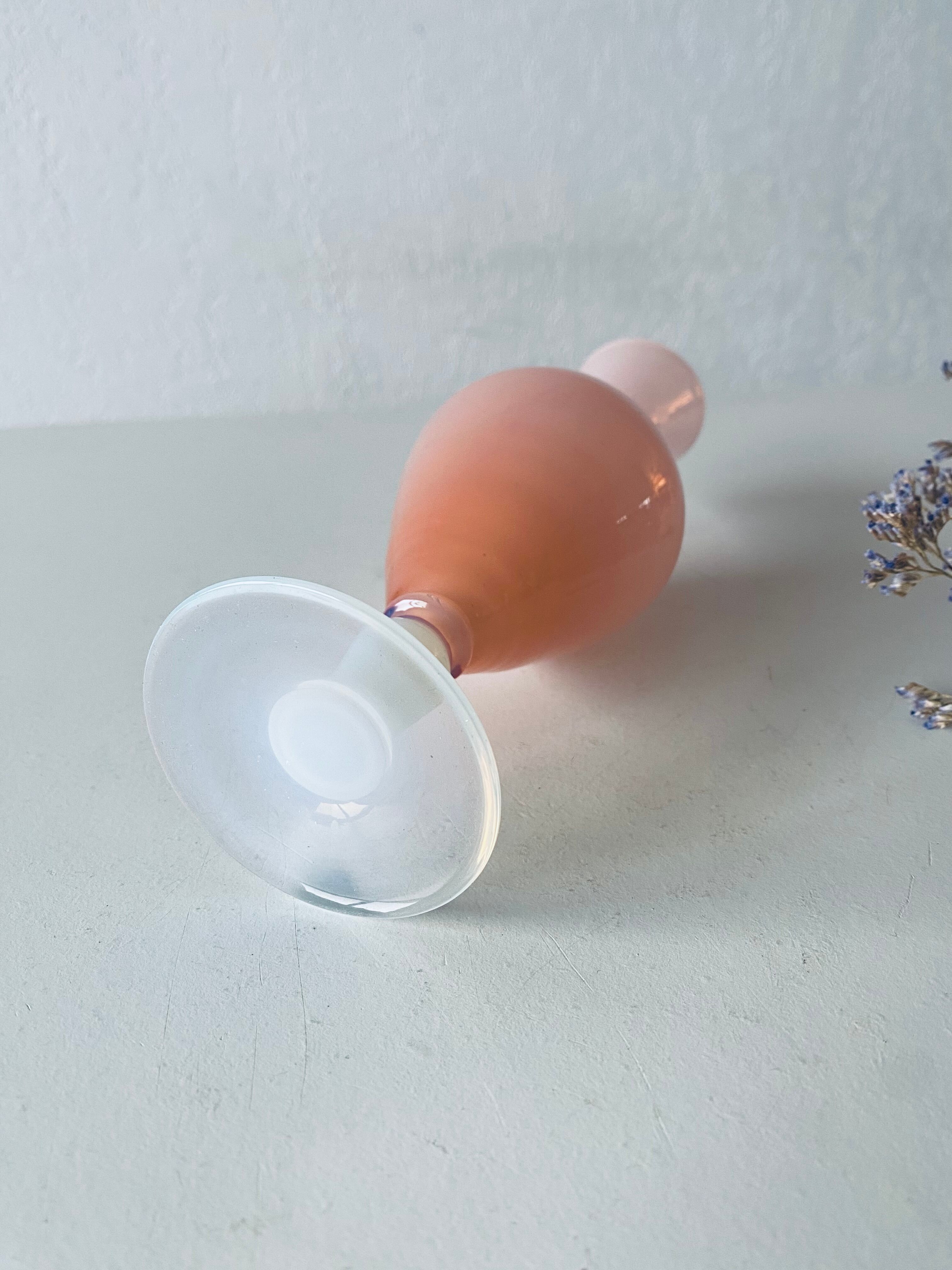 Old vase in pink opaline