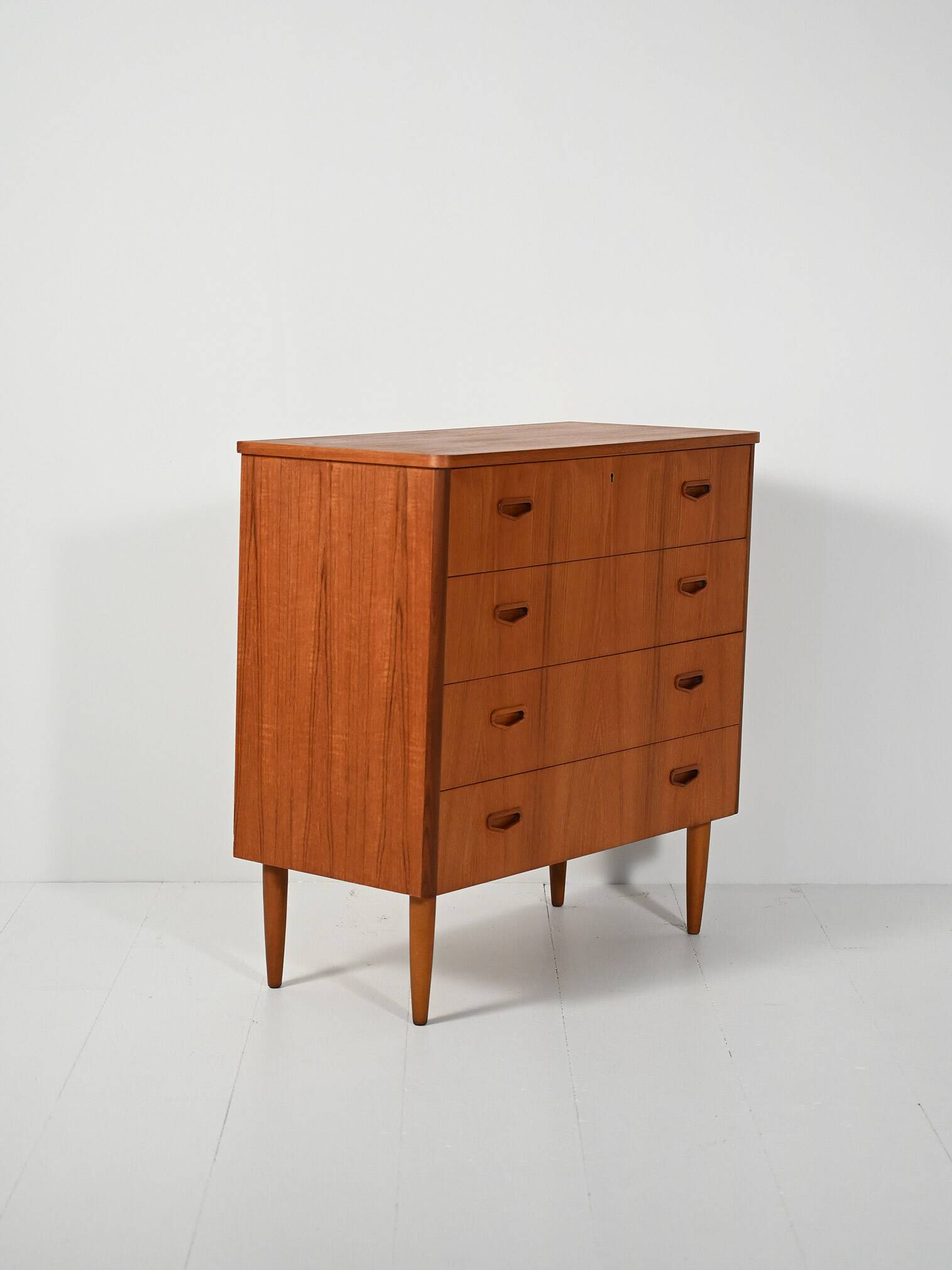 Scandinavian teak chest of drawers with sculpted recessed pulls