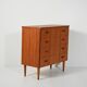 Scandinavian teak chest of drawers with sculpted recessed pulls