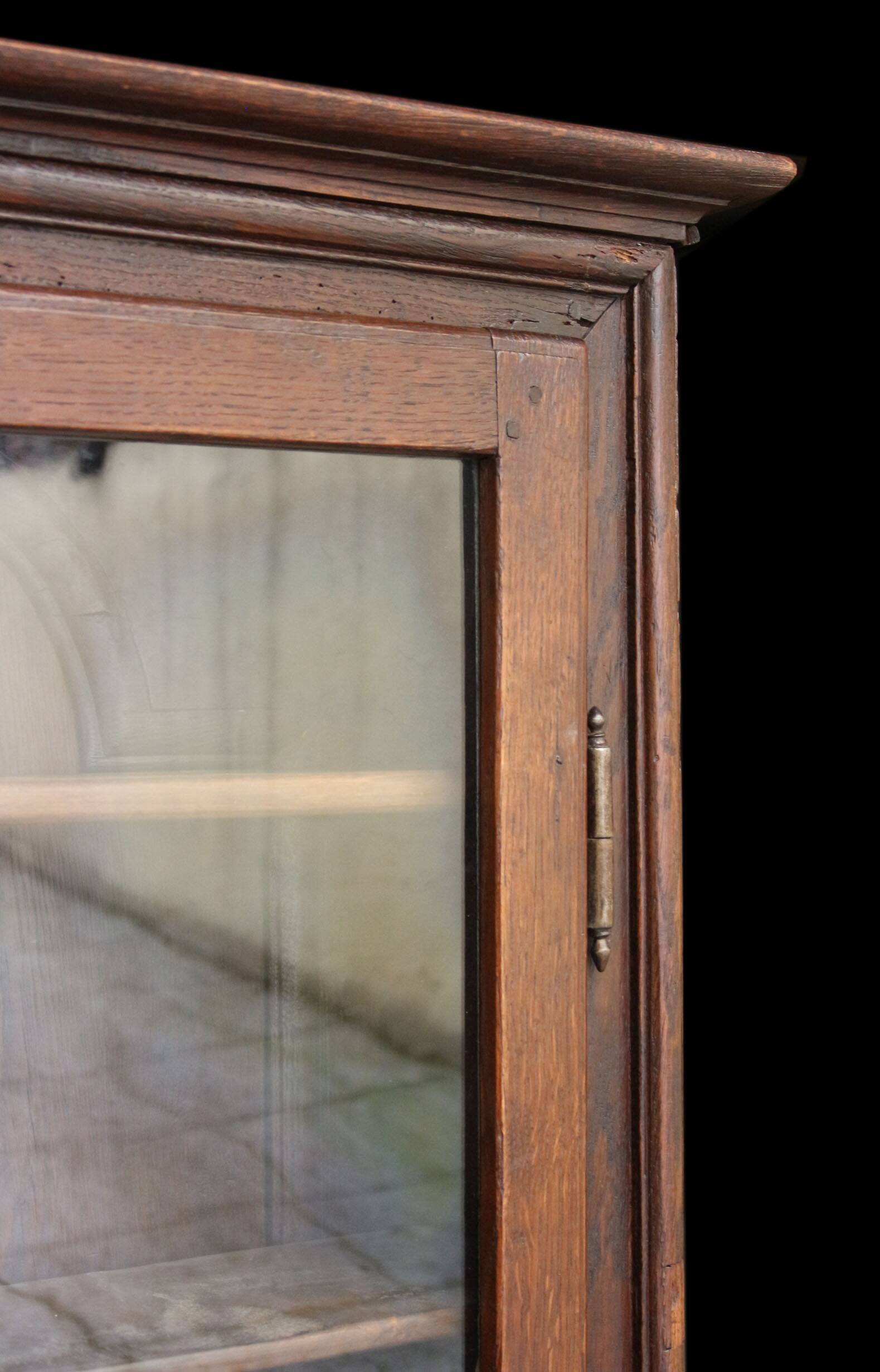 Elegant 18th century solid oak display cabinet.
