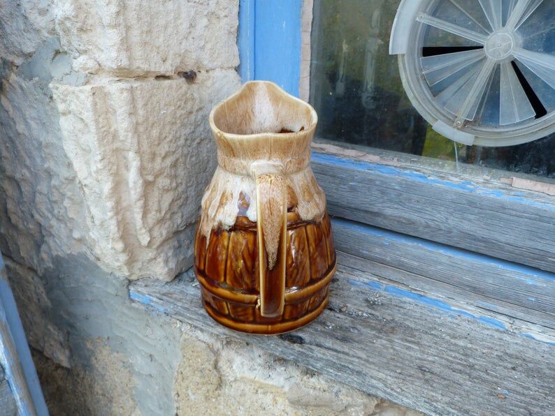 Former wine pitcher in glazed earth style bistrot auberge