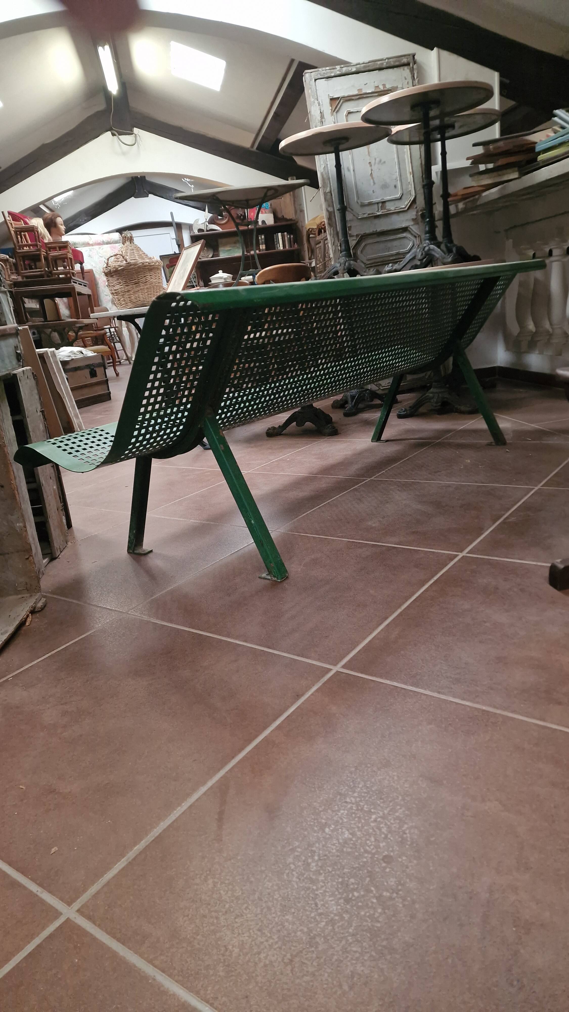 Vintage green perforated metal public bench
