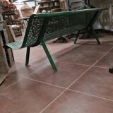 Vintage green perforated metal public bench