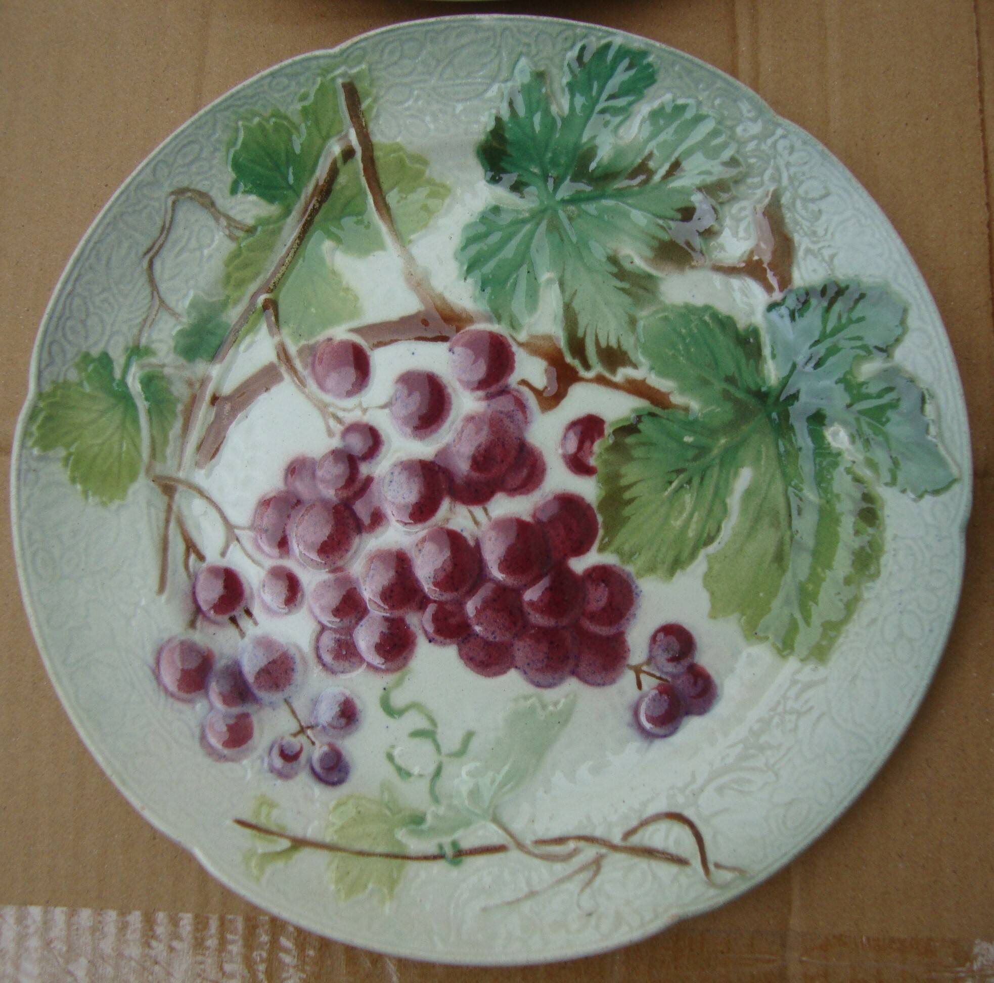 Set of 4 Keller and Guerin St Clement Majolica plates with fruit decoration.