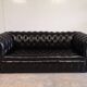 Black leather chesterfield sofa