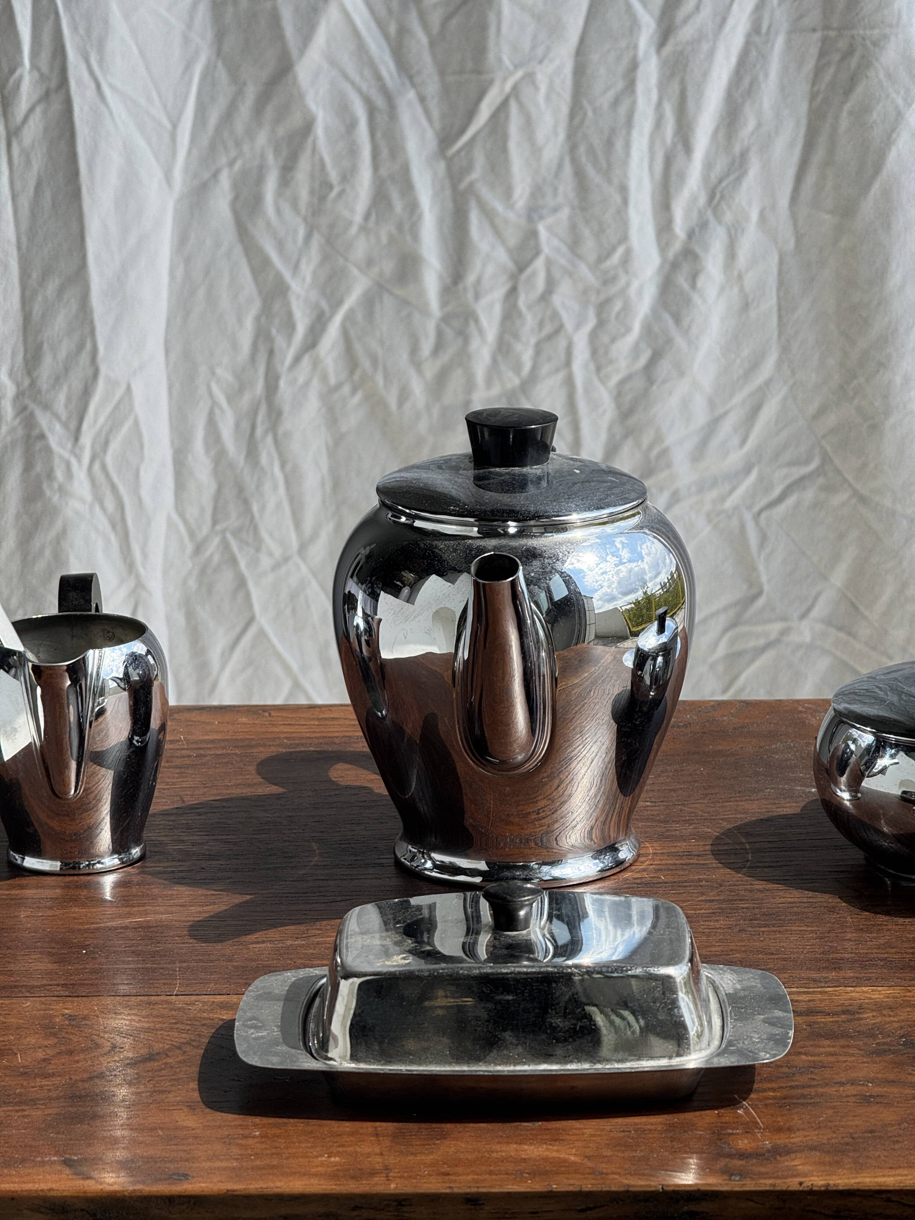 Tea set including teapot, milk jug, sugar bowl and butter dish