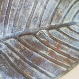 Greenish metal leaf pocket emptier