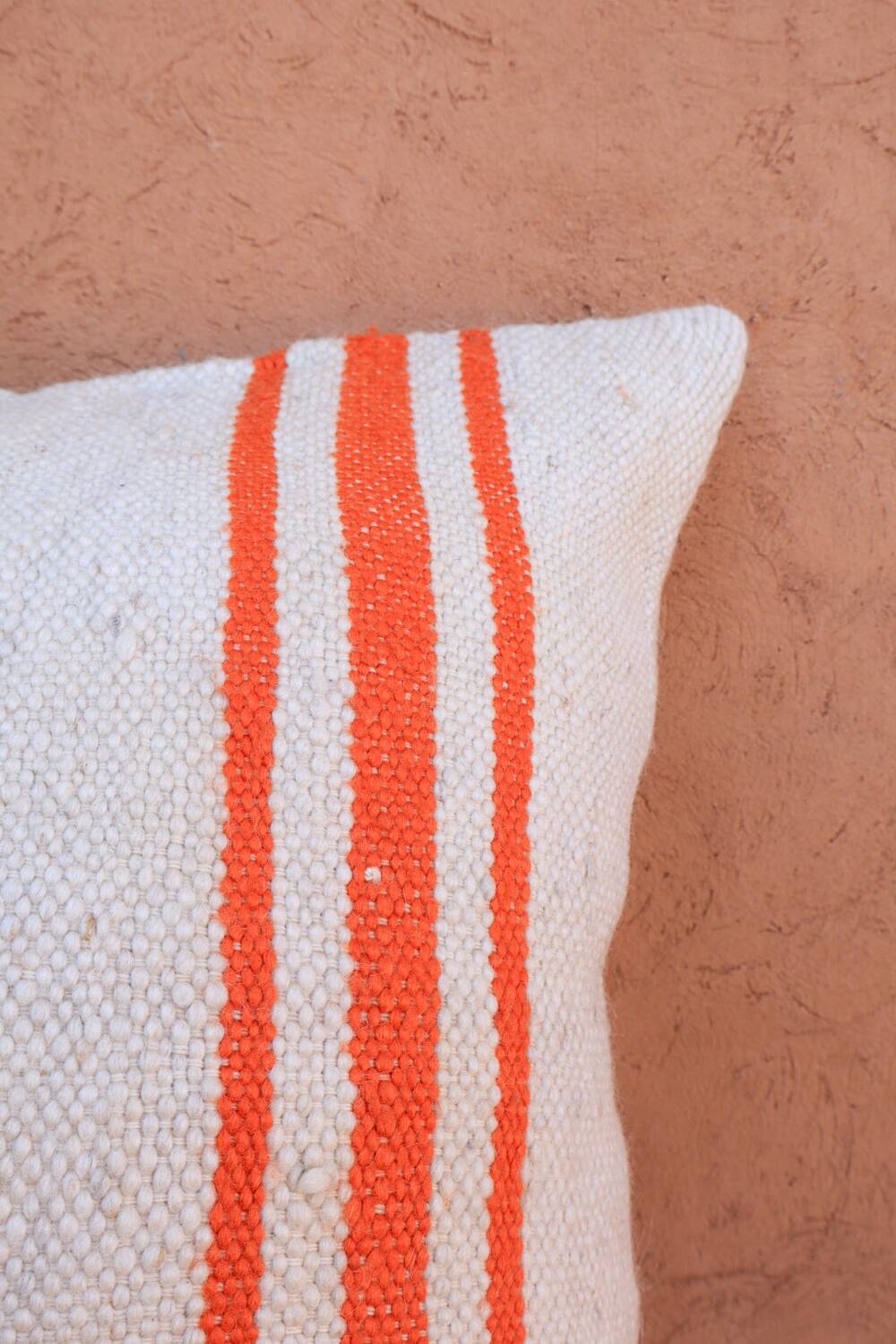 Orange and white striped handmade wool cushion