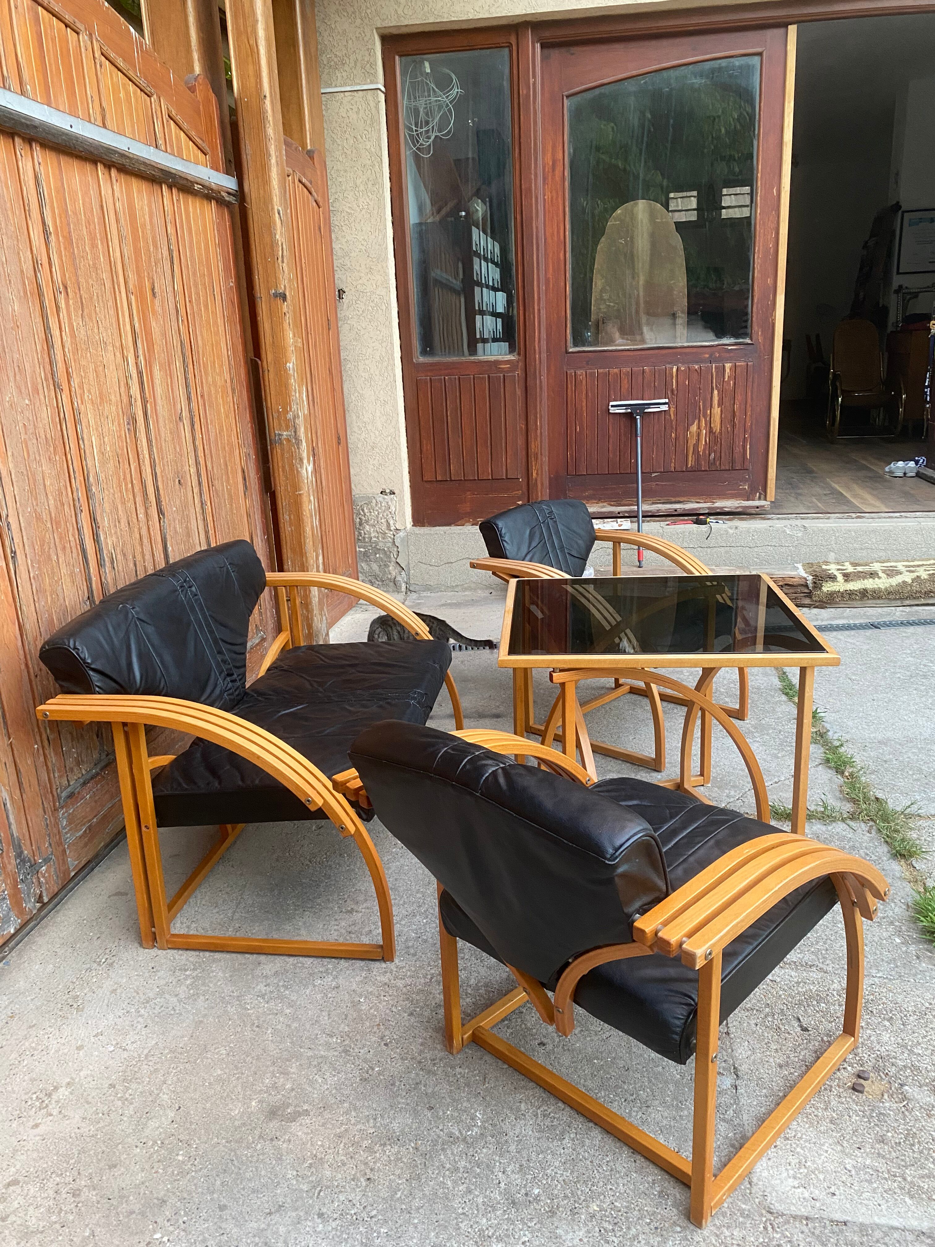 Mid-century leather sofa, 2 fotels, and table in sett