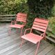 Set of 2 low armchairs Fermob model Monceau in capucine colour.