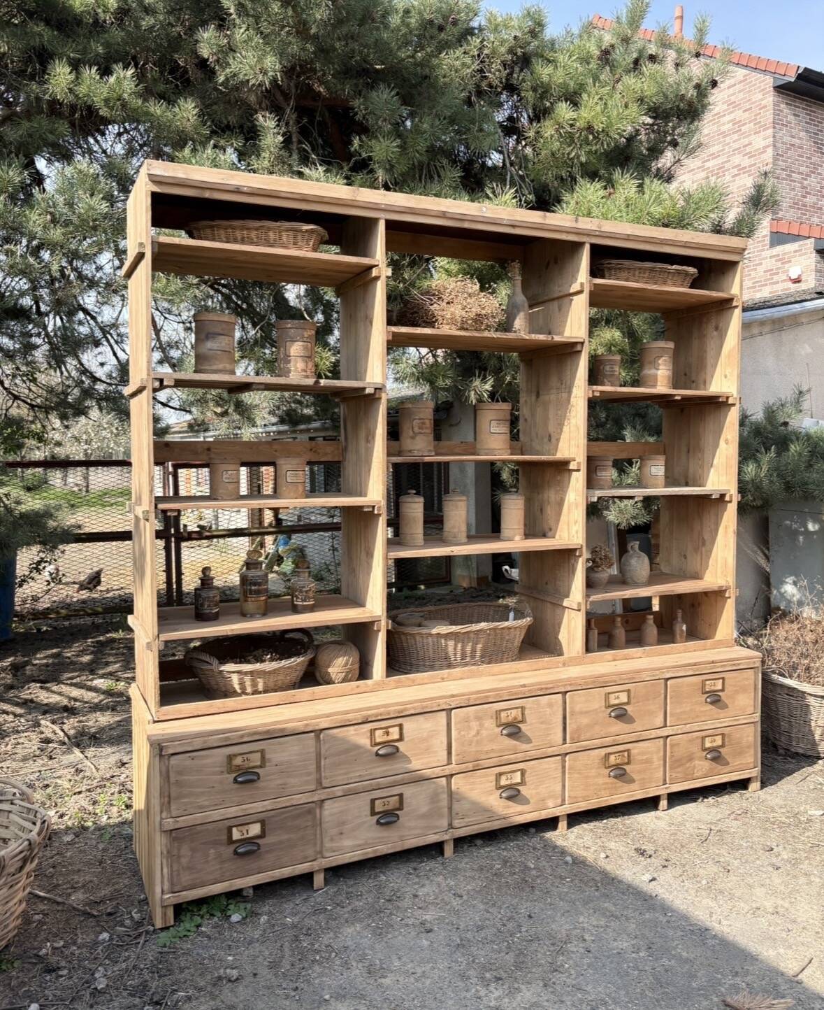 Large antique workshop furniture with drawers and shelves.