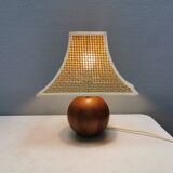 Very rare table lamp in turned teak wood with original braided shade. 1970s