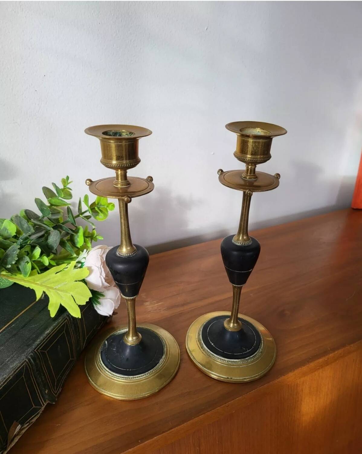 Pair of brass and black hard stone candlesticks