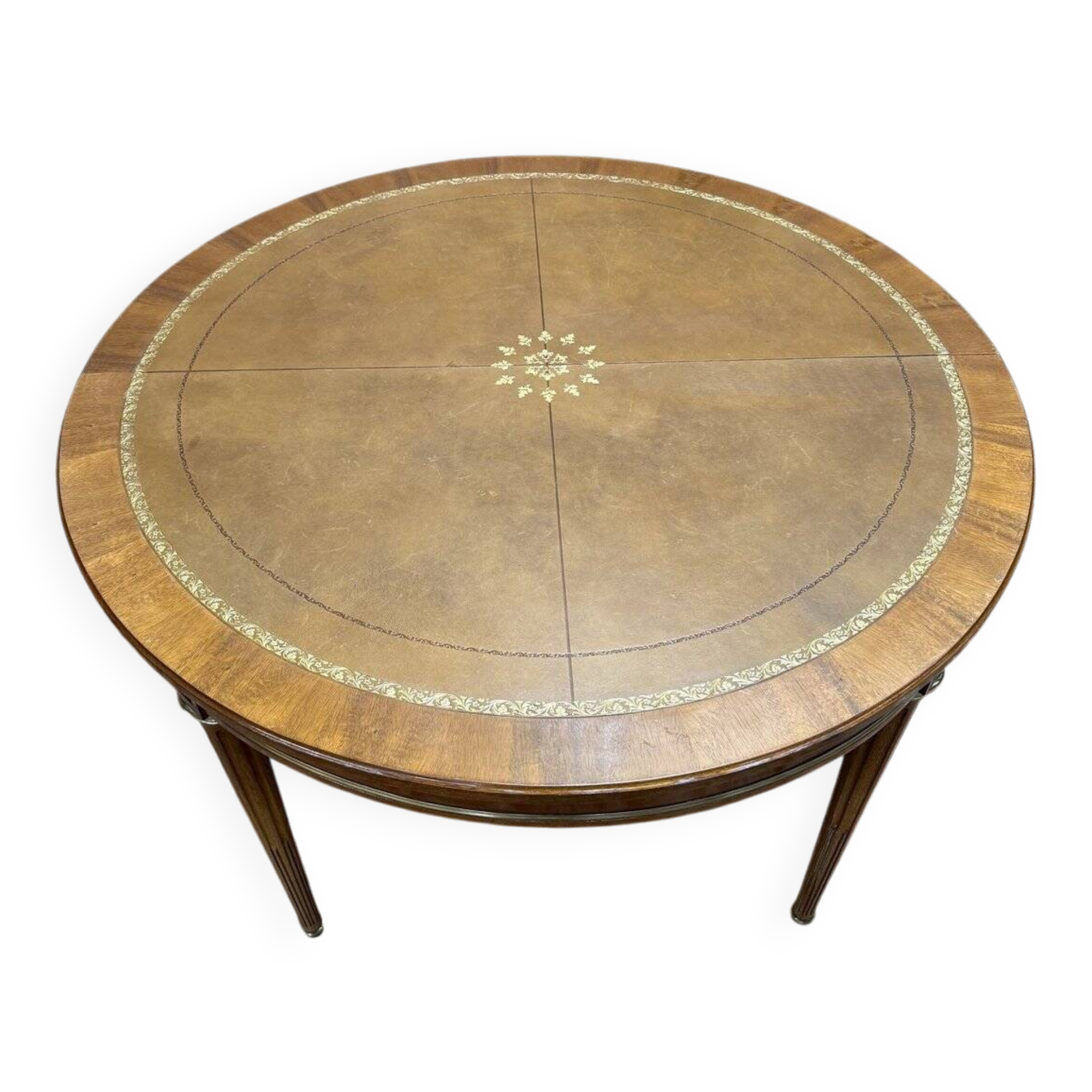Round dining table with leather top in Louis XVI style.