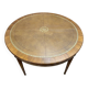 Round dining table with leather top in Louis XVI style.