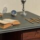 Modernist desk in wood and green moleskin upholstery