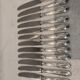 12 silver-plated metal dessert knives with rocaille ribbon decoration, 21.4 cm