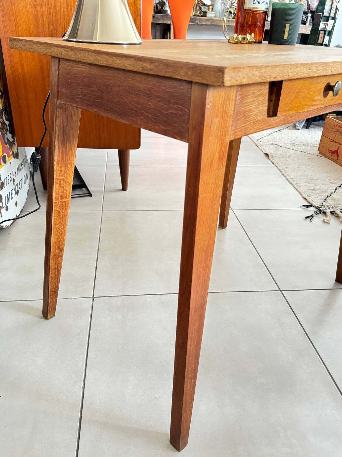 Old wooden desk or side table with compass legs